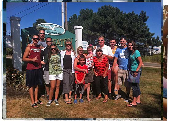 Family reunion and this is a group shot in front of the Camp Eaton sign at the street.